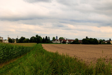 View over the fields near Augsburg towards the Pfersee district with the hotel tower and church...