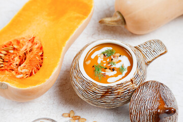 Traditional autumn butternut squash soup with seeds.