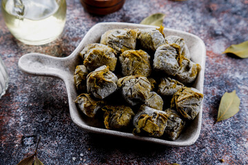Dolma - stuffed grape leaves with rice and meat.