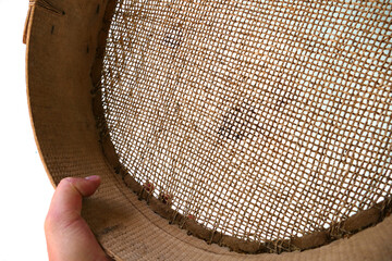 a fine-mesh sieve made of leather for sifting grain,