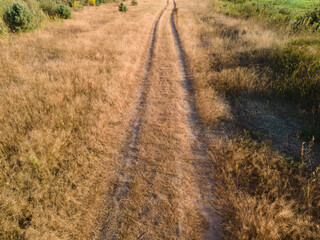 Fototapeta premium View of the roads, landscape and fields from the height of a flying drone. 