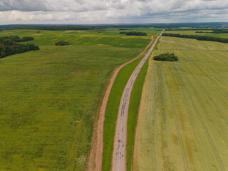 View of the roads, landscape and fields from the height of a flying drone. 