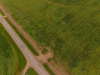 View of the roads, landscape and fields from the height of a flying drone. 