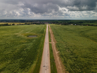 View of the roads, landscape and fields from the height of a flying drone. 