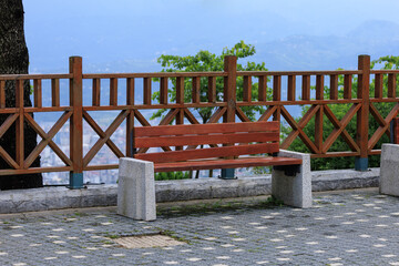 Wooden benches and chaise lounges for rest on the streets of the city and in the park, public places