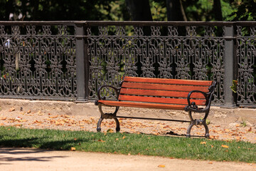 Wooden benches and chaise lounges for rest on the streets of the city and in the park, public places