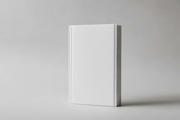 Mockup of a white book cover standing upright with a shadow on a plain neutral background