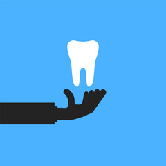 white tooth in hand like teeth protection icon