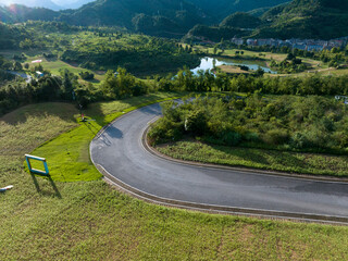 view of curve road near mountain