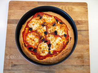 Fresh, hot, oven-baked Italian Neapolitan pizza with mozzarella cheese