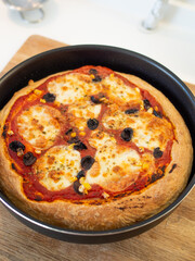 Fresh, hot, oven-baked Italian Neapolitan pizza with mozzarella cheese