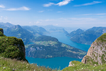 The Stoos hike in summer offers breathtaking views of the Swiss Alps, lush green meadows, and serene lakes. The trail is accessible yet challenging, with panoramic vistas that make every step rewardin