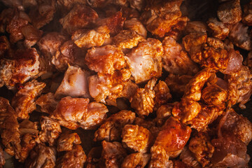 Turkey meat is fried in a pan. Background or banner, place to copy space, close-up.