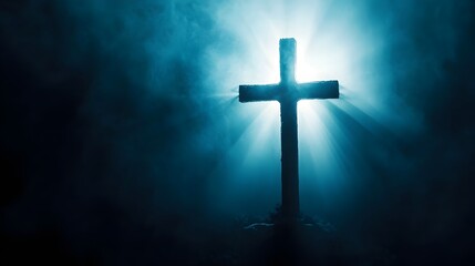 Silhouette of a cross with light rays and smoke 