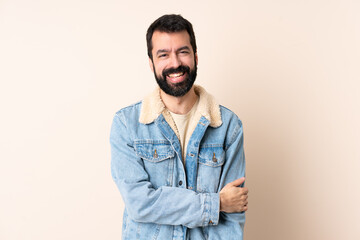 Caucasian man with beard over isolated background laughing