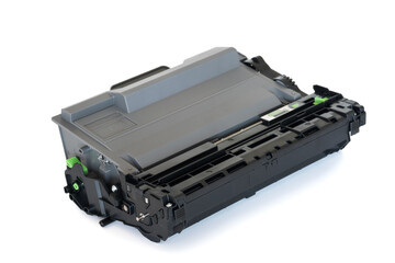 High-angle view of a toner cartridge for a printer, placed on a white surface, emphasizing its...