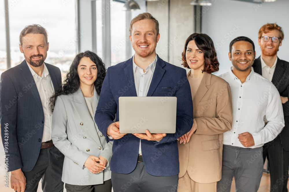 Aufkleber a diverse group of business professionals stand together in a modern office setting. the man in the 