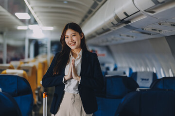 Asian young women passenger walk in airport terminal to boarding gate. Attractive beautiful female tourist friends feeling happy and excited to go travel abroad by airplane for holiday vacation trip.