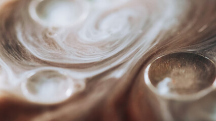 Blur foam. Glitter mist. Defocused white bronze beige color transparent sparkling bubbles floating ink water stream abstract art background.