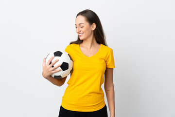 Young football player woman over isolated white background looking side