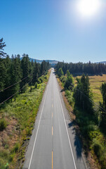 Scenic Highway Road in Interiror BC, Canada. Sunny Summer Day. Aerial view