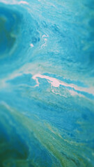 Brilliant paint. Wet shimmering texture. Blue green defocused mix liquid marble blend wave creative overflowing colors background.