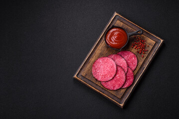 Delicious smoked salami sausage sliced with salt, spices and herbs