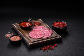Delicious smoked salami sausage sliced with salt, spices and herbs