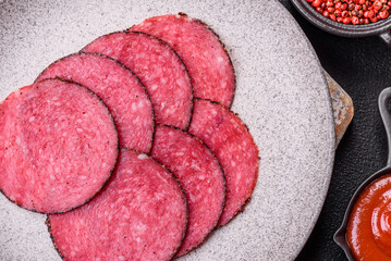 Delicious smoked salami sausage sliced with salt, spices and herbs