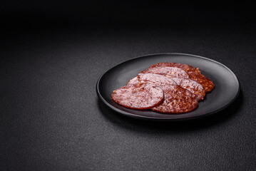 Delicious smoked pepperoni sausage sliced with salt, spices and herbs
