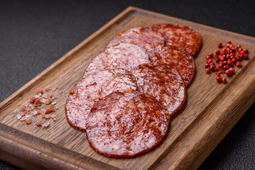 Delicious smoked pepperoni sausage sliced with salt, spices and herbs
