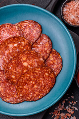 Delicious smoked pepperoni sausage sliced with salt, spices and herbs