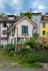 Winterthur, Switzerland - July 1, 2024: Quaint street in Winterthur with colorful old houses and greenery.