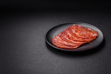 Delicious smoked meat sliced with salt, spices and herbs