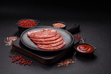Delicious smoked meat sliced with salt, spices and herbs