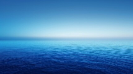 Obraz premium A smooth gradient background that goes from dark blue at the top to a lighter blue at the bottom.