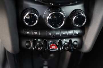 Car interior showcasing the dashboard and control panel. The dashboard is filled with various...