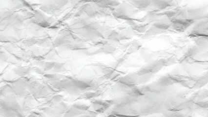 Modern crumpled white paper on empty sheet gray background.