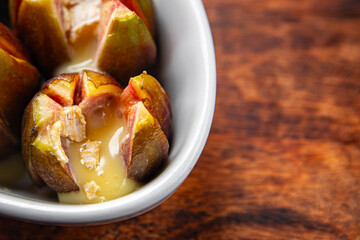 figs baked with cheese camembert or brie fresh meal food snack on the table copy space food background rustic top view keto or paleo diet vegetarian vegan food