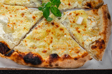 pizza four types of cheese mozzarella, blue cheese, camembert and cheddar fresh meal food snack on the table copy space food background rustic top view