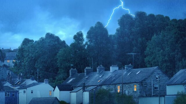 Lightning Strikes Behind Houses On Stormy Evening