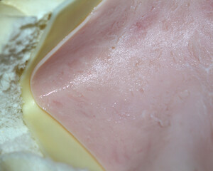 Fototapeta premium cheese and ham on bread. meal details. bread with ham and cheese. food background.