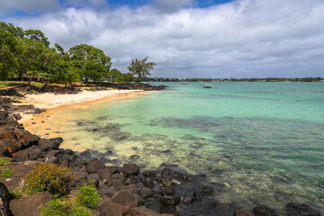 Exposure of the amazing la Cuvette Beach, located in the center of the busy town of Grand Bay, with crystal clear water and beautiful shades of blue perfect for who is looking for a relaxing vacation