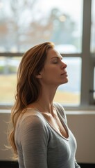 Woman Practicing Breathing Exercise at Self Defense Psychology Seminar in Professional Setting