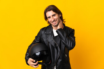 Man with a motorcycle helmet isolated on yellow background laughing