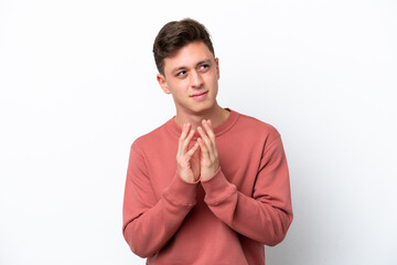 Young handsome Brazilian man isolated on white background scheming something