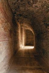 Obraz premium Durres,Albania, August 7,2024:inside the amphitheater of the city of Durres, the largest Roman amphitheater in the Balkans