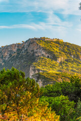 Voidokilia beach, lagoon with beaches in mediterranean, Ionian Sea, Pylos town , Greece. Navarino Castle on hill.