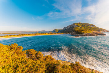 Voidokilia beach, lagoon with beaches in mediterranean, Ionian Sea, Pylos town , Greece. Navarino Castle on hill.