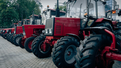 A row of Red Tractors in the parking lot